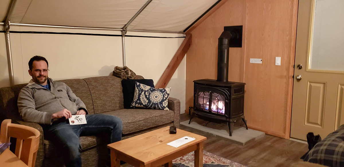 Mount Engadine Lodge glamping tent pull out couch and propane gas fire place