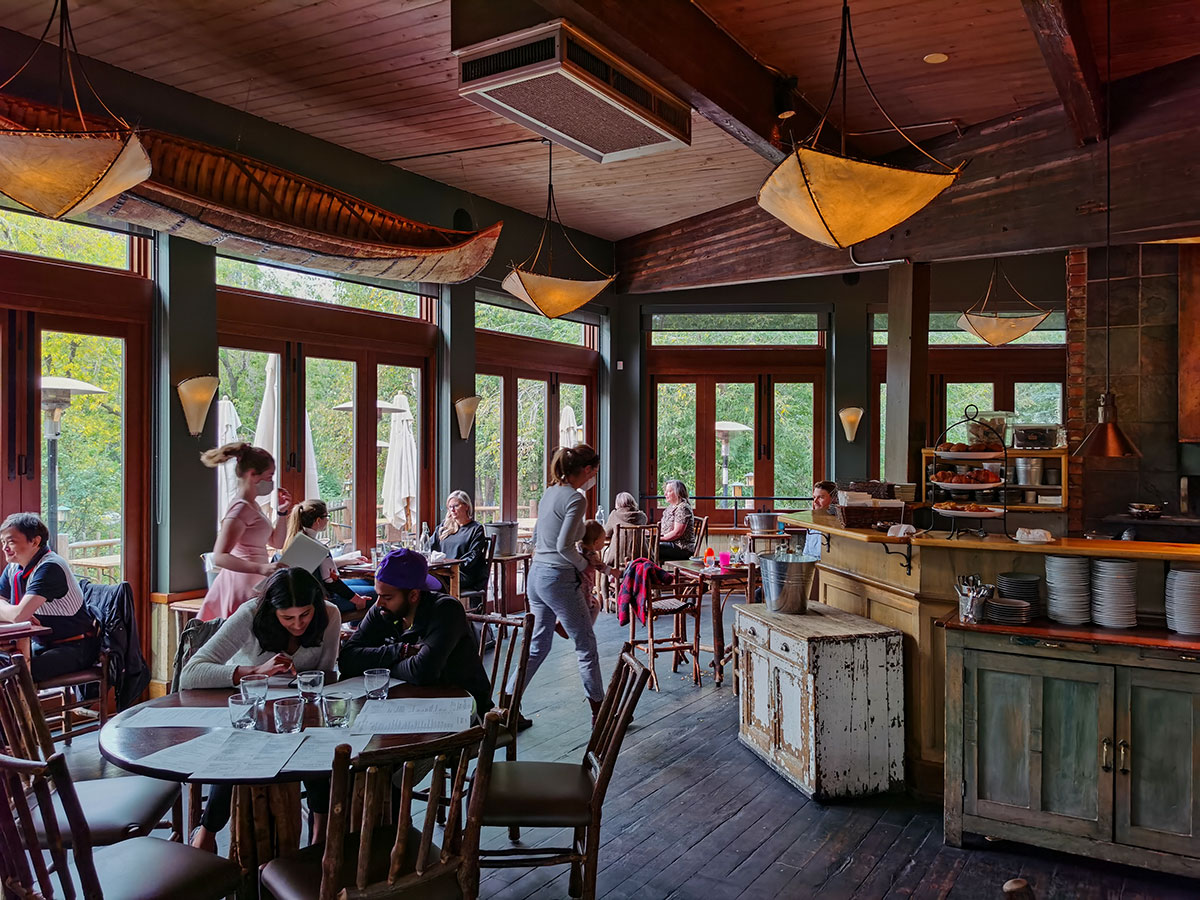 River Café at Prince's Island Park tables with glass windows overlooking patio